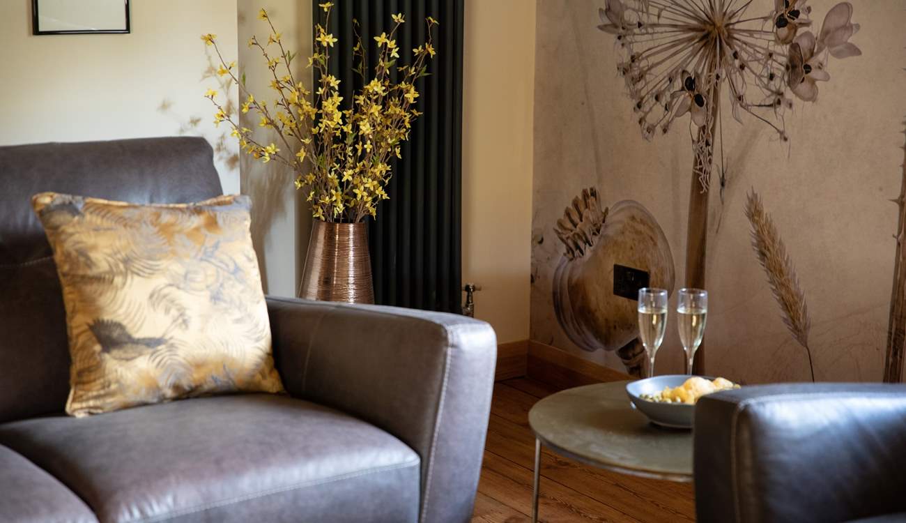 Switch off and relax in the super-stylish sitting-room that has views out over the countryside.