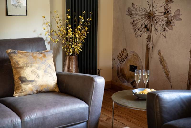 Switch off and relax in the super-stylish sitting-room that has views out over the countryside.
