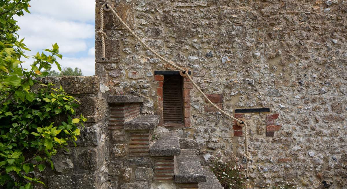 These original external steps are quite steep so please take care and use the rope handrail. The area you can see on the left-hand side, at the top of the steps, is not enclosed so please be mindful not to go too close to the edge.