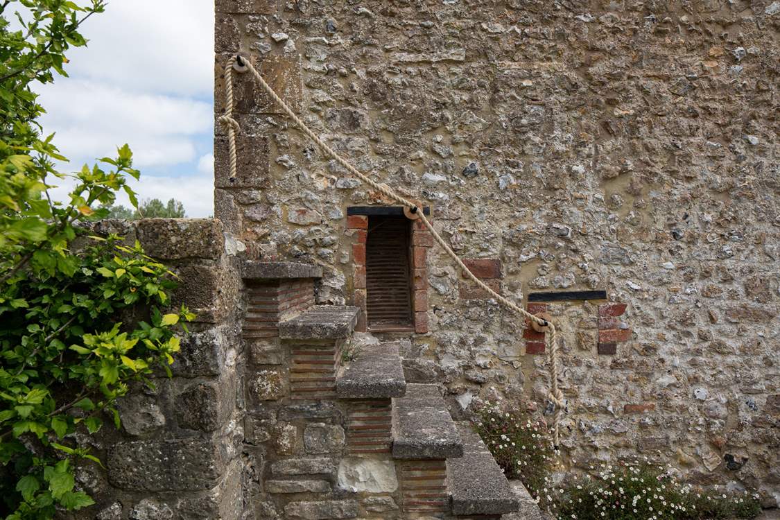 These original external steps are quite steep so please take care and use the rope handrail. The area you can see on the left-hand side, at the top of the steps, is not enclosed so please be mindful not to go too close to the edge.