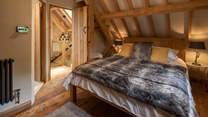 Super-soft linens and throws make a cosy sanctuary.