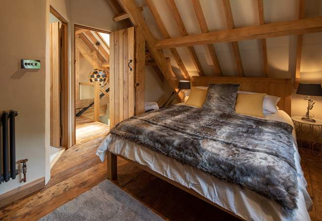 Super-soft linens and throws make a cosy sanctuary.