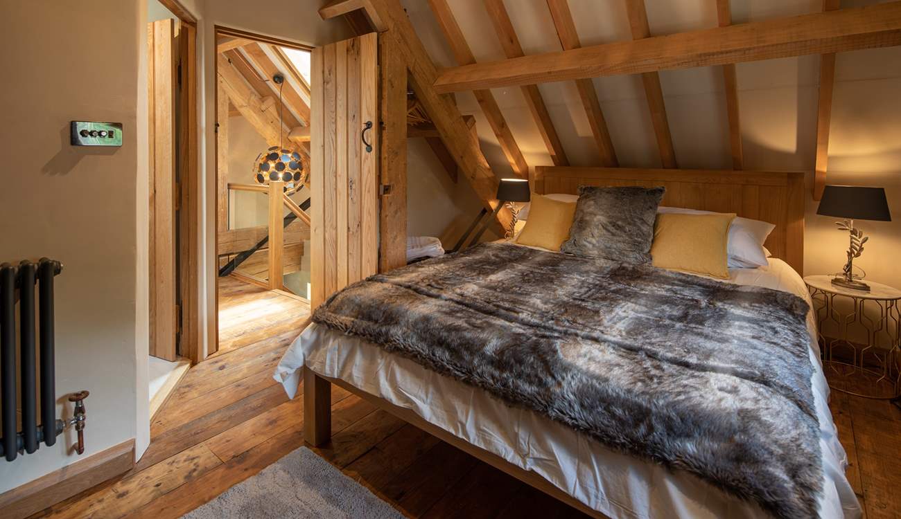 Super-soft linens and throws make a cosy sanctuary.