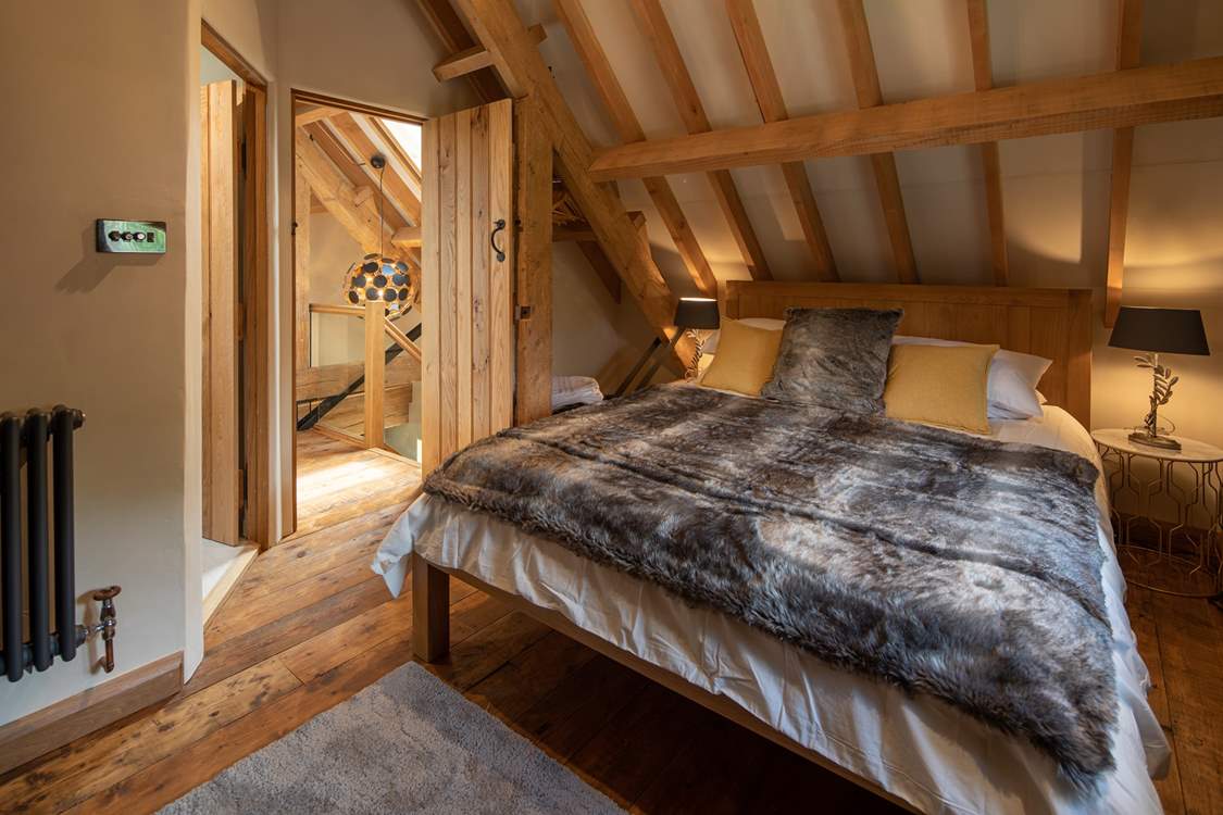 Super-soft linens and throws make a cosy sanctuary.