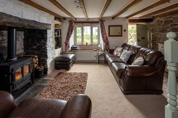 Cosy sitting-room. Perfect for snuggling up in after a action packed day of adventure.