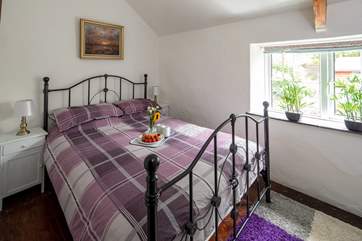 Bedroom 1 is so pretty and inviting.