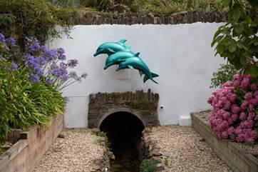 Just look for the dolphins and you know your home. Please note, the stream running in front of the property is fully fenced off and secure.