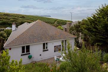 Aerial view from the top balcony overlooking the house and out to sea. Glorious even on a gloomy day.