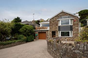 Dolphin House is a spacious detached house at the end of the cul-de-sac.