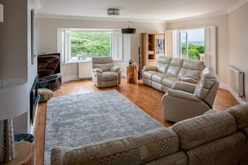 Spacious sitting-room which opens out onto the balcony.