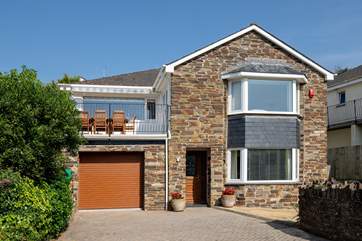 Dolphin House is a spacious detached house at the end of the cul-de-sac.