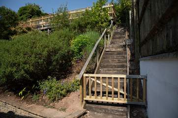 Steps up to the raised sun bathing patio area.