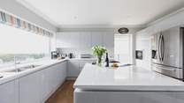 The kitchen is fully equipped with all mod-cons and offers oodles of space to whip up a feast.