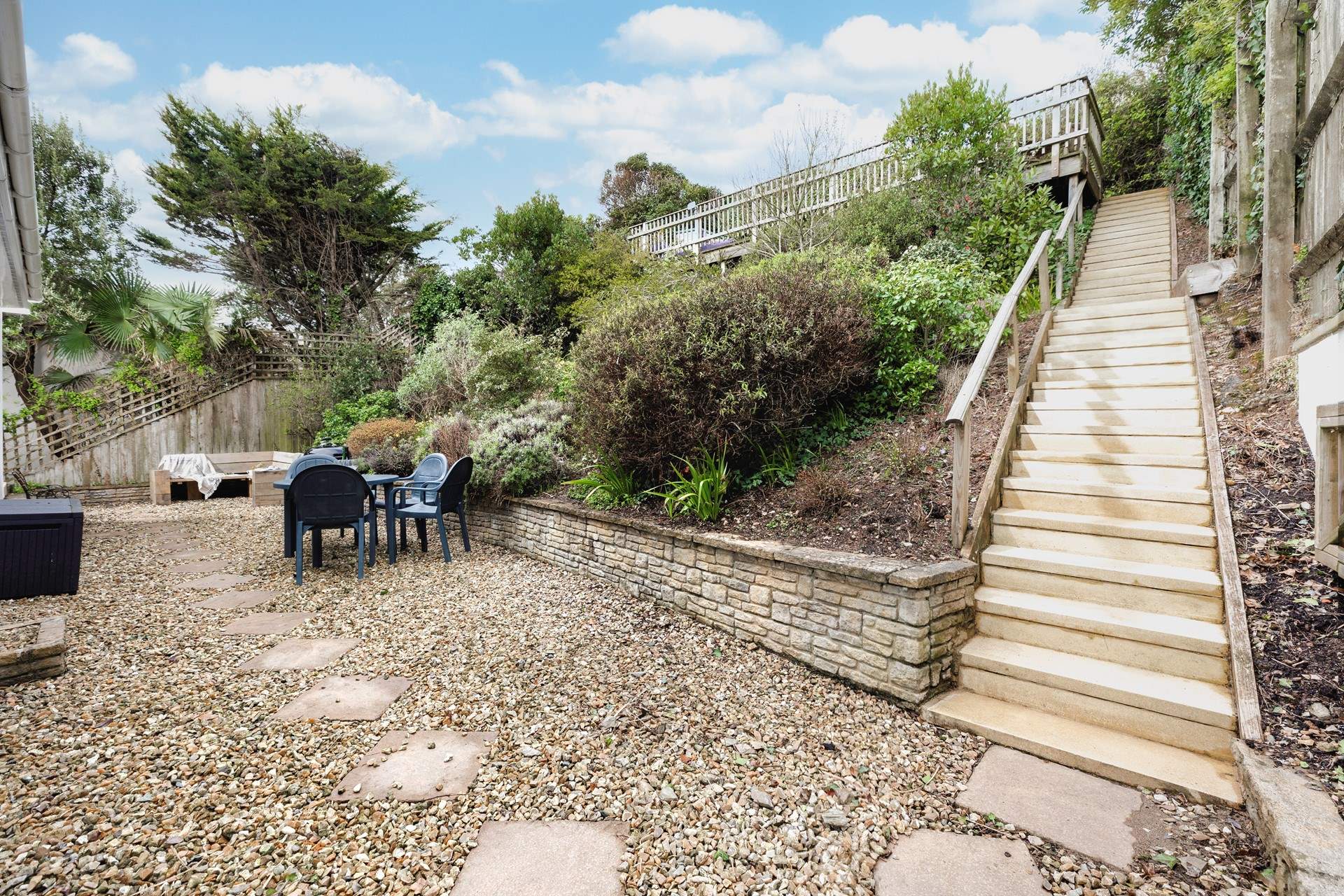 The rear patio area is a fully enclosed and a great place to let your four-legged friends off the leash. Steps up to the raised sun bathing patio area.

