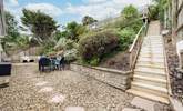 The rear patio area is a fully enclosed and a great place to let your four-legged friends off the leash. Steps up to the raised sun bathing patio area.

 - Thumbnail Image