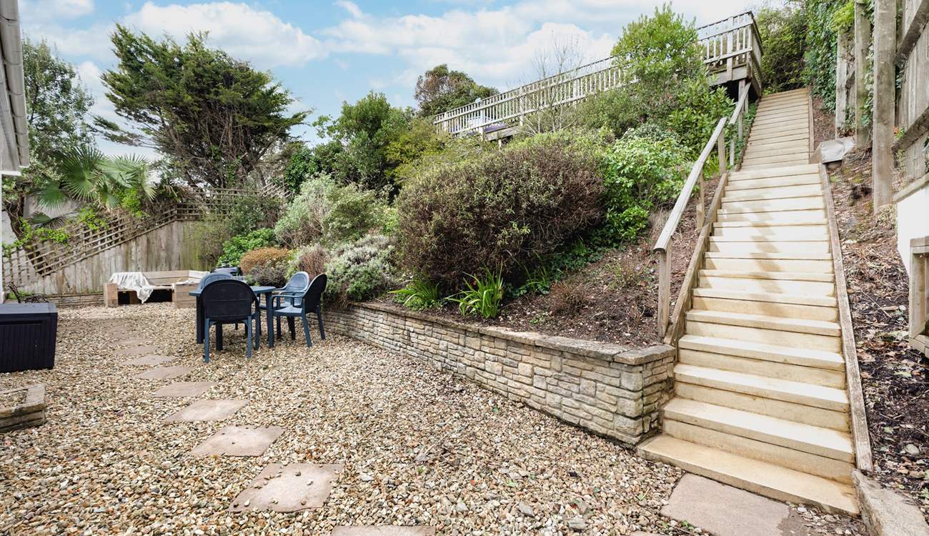 The rear patio area is a fully enclosed and a great place to let your four-legged friends off the leash. Steps up to the raised sun bathing patio area.

