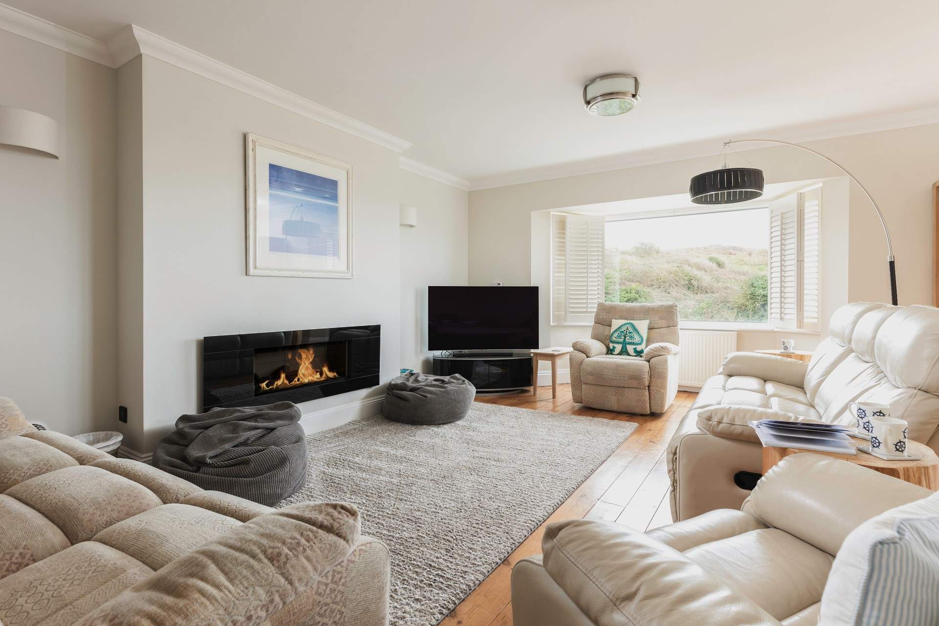 The spacious sitting-room opens out onto the balcony.