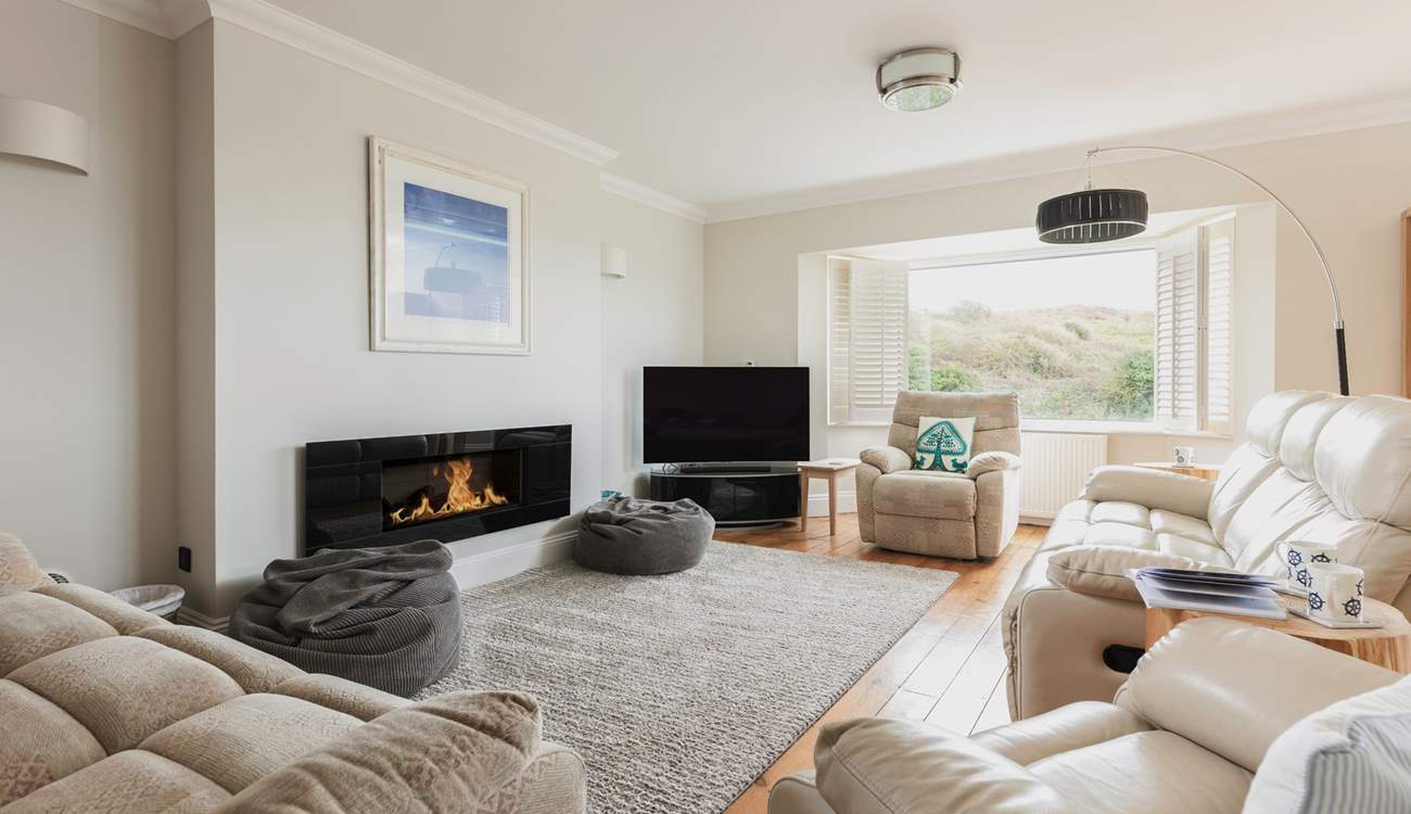 The spacious sitting-room opens out onto the balcony.