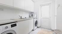 The separate utility room on the ground floor.