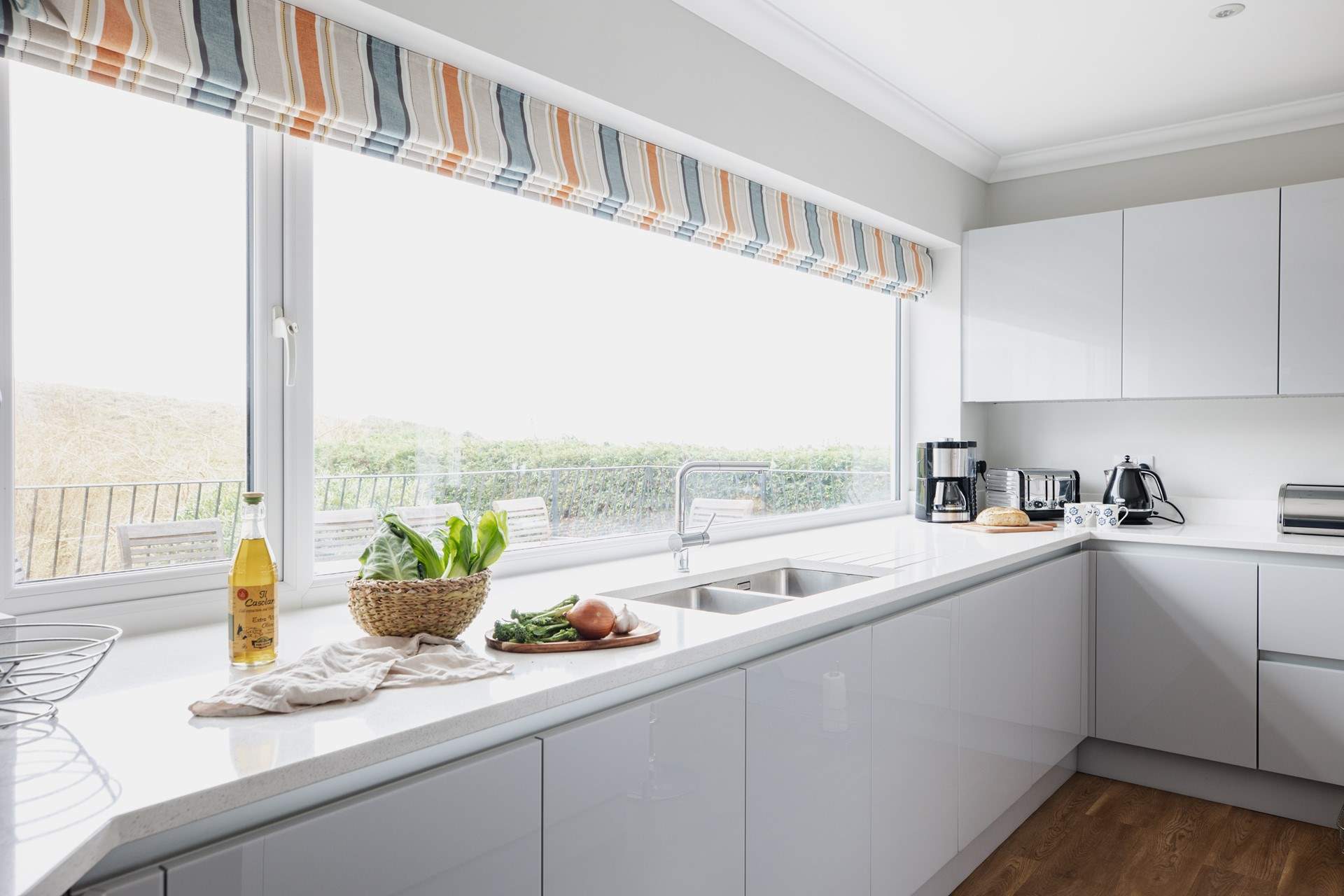 The kitchen fills with natural light. 