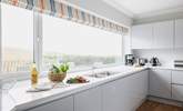 The kitchen fills with natural light.  - Thumbnail Image