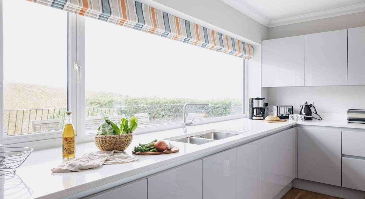 The kitchen fills with natural light. 