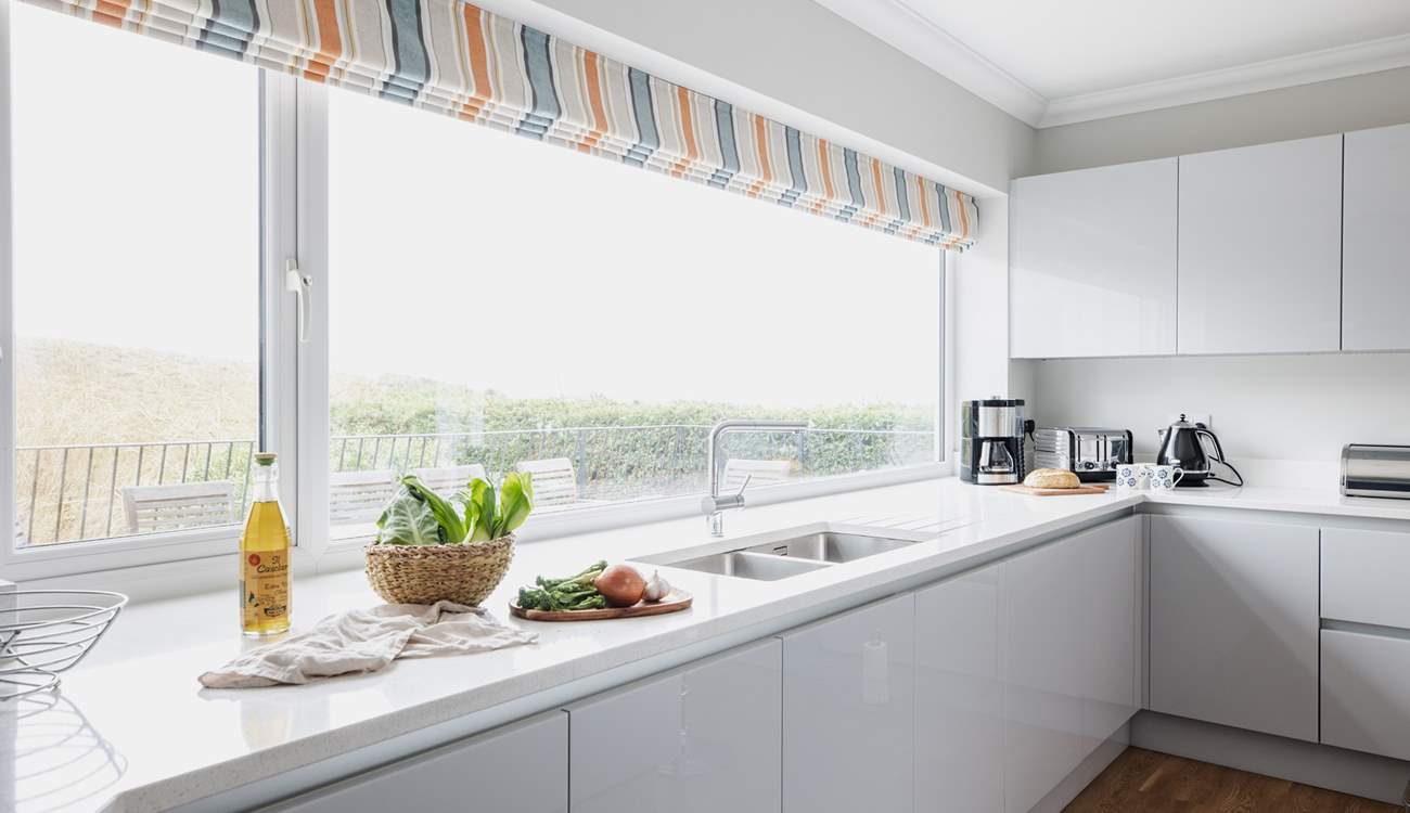 The kitchen fills with natural light. 