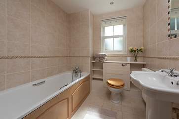 Have a relaxing soak in the bath in the family bathroom.