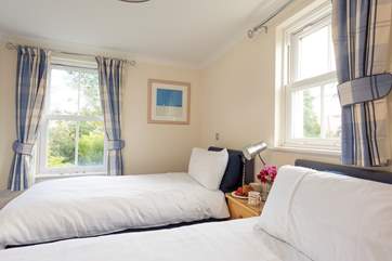 The twin bedroom also overlooks the communal garden at the back of the property.