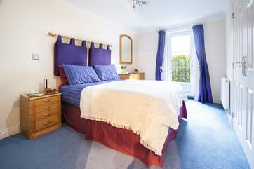 The main bedroom is at the back of the property and overlooks the communal gardens (Bedroom 1).