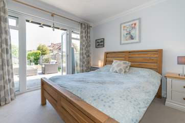 Take advantage of the patio doors from the master bedroom while watching the sun rise.