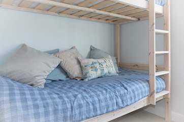 The bunk bed on the ground floor has full sized singles so are ideal for both children and adults.