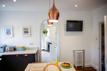 From the kitchen you can also access the hall, as well as the lower ground floor via a door and stairs down.