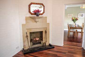 From the hall you walk into the sitting/dining-room which is a room that will become a firm favourite. This fireplace is ornamental.