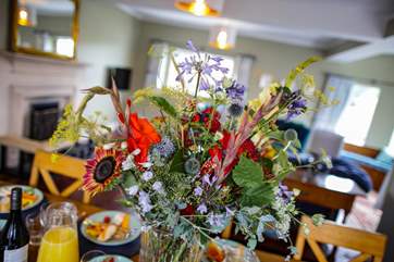 The sitting/dining-room is a spacious area for all the family to enjoy, or provide the perfect adult chill out area.