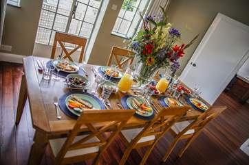 The dining-area offers the perfect table to come together at the end of the day. The patio doors can also be opened giving you access to the garden and patio area.
