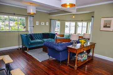 The living area not only benefits from wonderful views and beautiful furniture but also an open fire for those chiller evenings and a Smart TV.