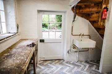 The store room is accessed down some stairs from the kitchen or through a garden door. This room offers the perfect space to store bikes, paddle boards and beach kit.