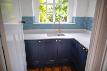 The utility-room sits just off the kitchen.