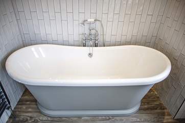 Nothing says luxury better than a roll-top bath, this is the stylish main bathroom.