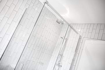 The shower in the main bathroom is larger than average.