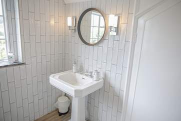 The en suite also benefits from an estuary view.