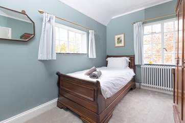 Bedroom four offers the perfect single bed with views of the garden.