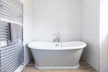Nothing says luxury better than a roll-top bath, this is the stylish main bathroom.