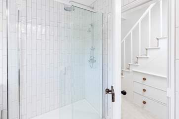 The shower in the main bathroom is larger than average.