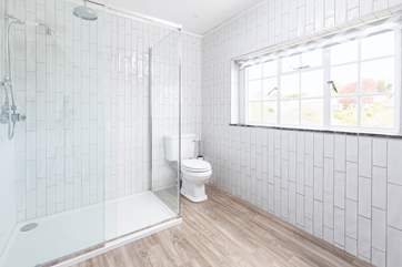 Bedroom one's en suite shower room, also treated to views of the estuary.