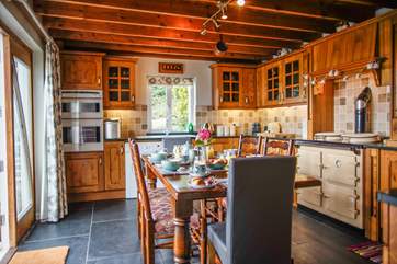 The heart of the cottage and the perfect spot for the family to enjoy a meal. Please note there is a step down into the kitchen from the sitting-room.