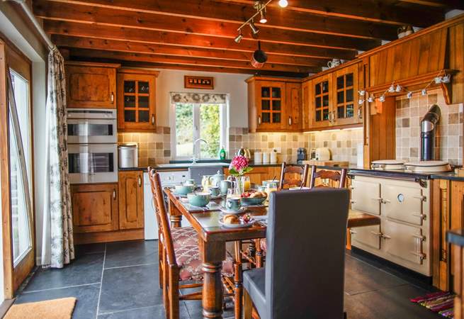 The heart of the cottage and the perfect spot for the family to enjoy a meal. Please note there is a step down into the kitchen from the sitting-room.