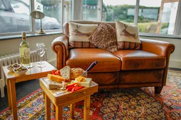 The sitting-room benefits from an extension allowing you to sit and enjoy the views or sit back and enjoy a film. Please note there is one step down from the original foot print of the cottage in to this extension area.