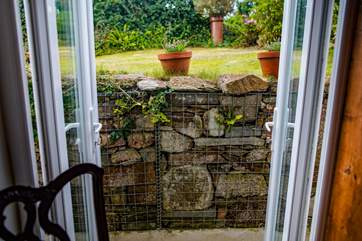 The double patio doors out to the garden from the downstairs double bedroom.